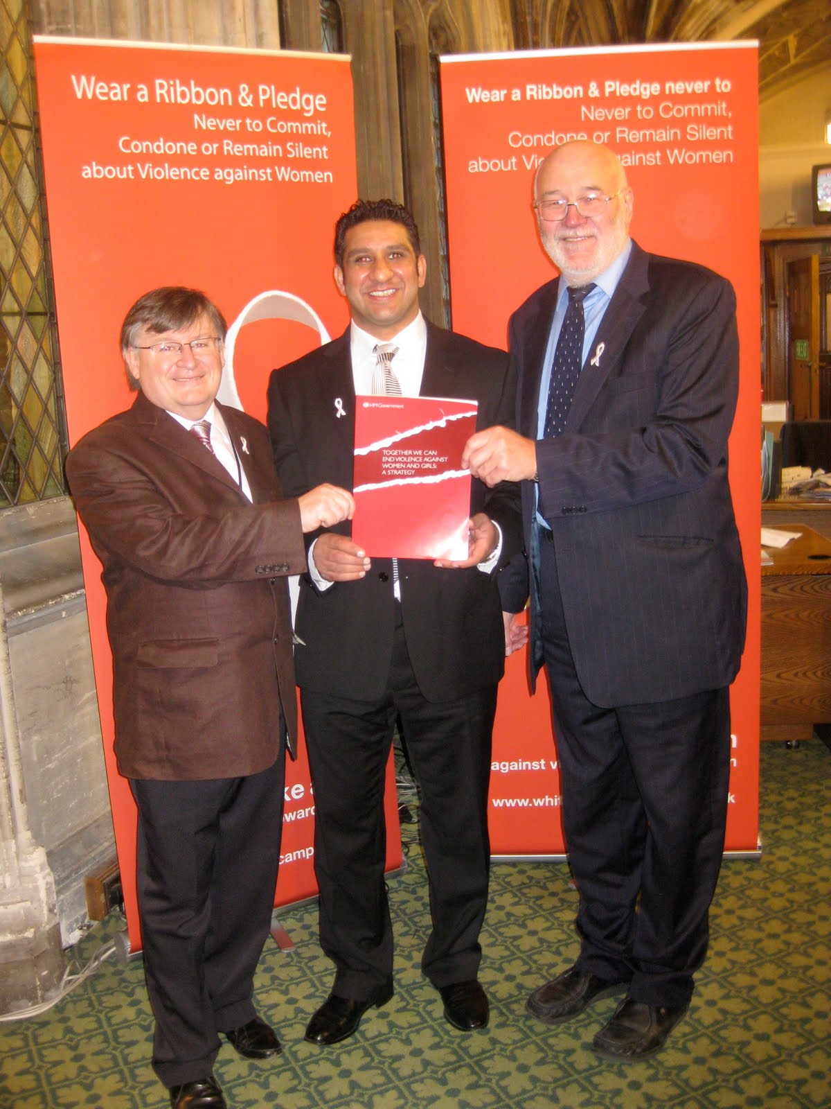 why are mps wearing red ribbons today