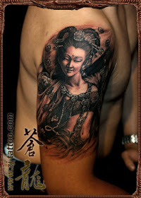an Asian style portrait tattoo on the arm