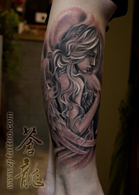 goddess tattoo on the leg