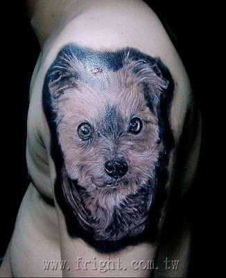 a pet dog tattoo design on the arm
