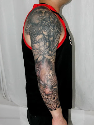 buddha and demon tattoo on the arm