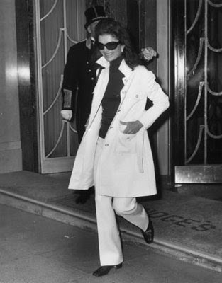 Now Jackie O Jackie in a white YSL and her signature black sunnies