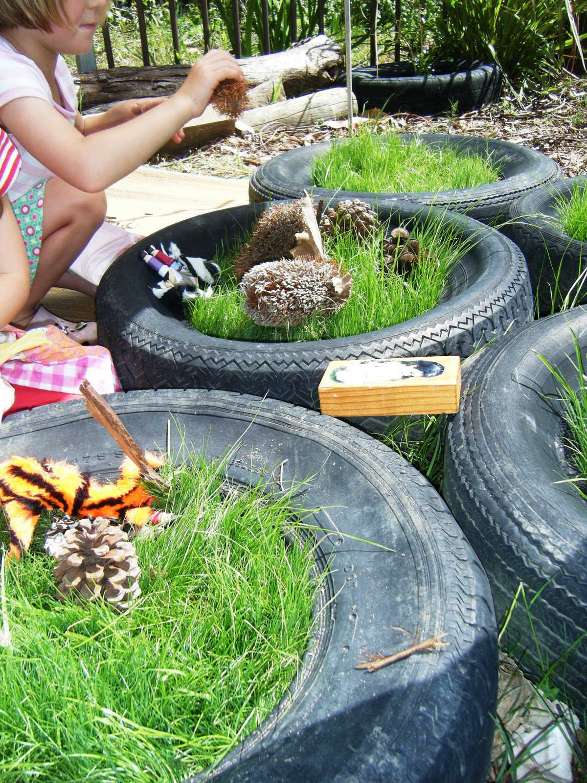 let the children play imaginative play in a tyre
