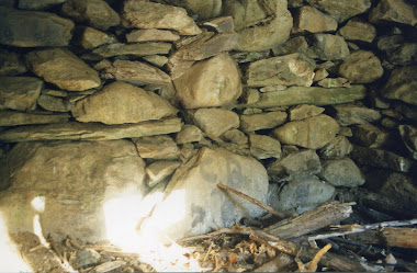 Face Carved in Stone in the Back of the Chamber