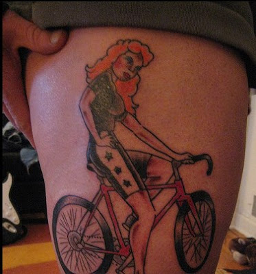 Re: My R bike tattoo. The woman on a left-hand drive bike (I'm smelling a