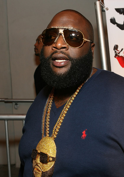 rick ross tattoos on his hand. Rick Ross keeps Tight Lid on