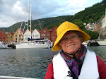 Bryggen i Bergen, and me in a Sydvest, the most sensible headgear in a boat.