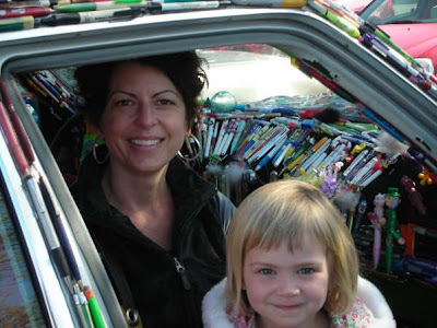 Amy and her daughter Cosette sitting inside the Pen Car