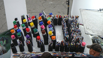 Crayola markers on the roof of the Mercedes Pens arranged by color