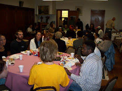 Faculty and Student share a meal