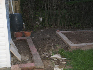 My newest flowerbed framed by patio stones
