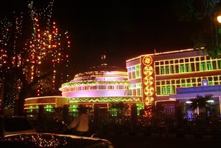 a government office illuminated with color lights for onam celebrations