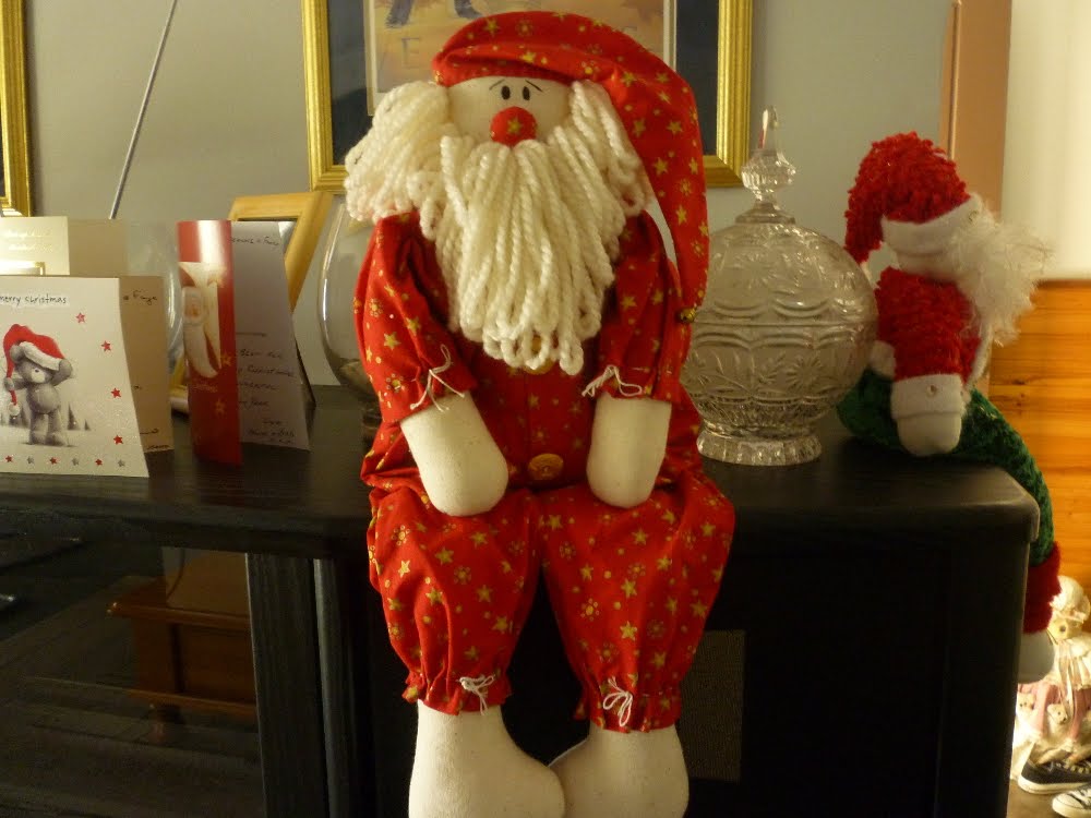 . Handmade fabric Santa's