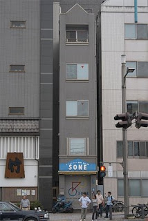 really skinny apartment building in asia photo