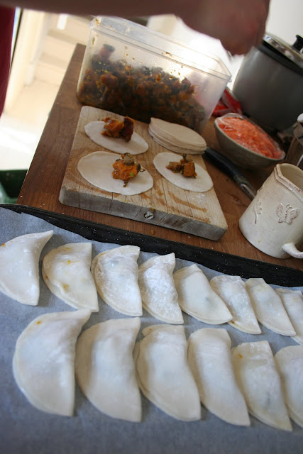 Dumpling skins filled with roast butternut squash and shitake mushrooms