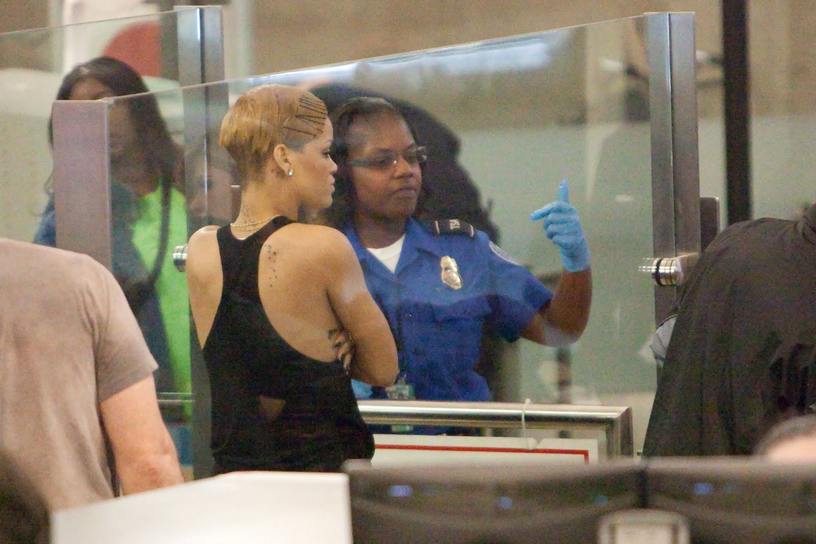 [Rihanna_-_Looks_distressed_as_she_receives_the_full_body_search_while_trying_to_depart_LAX_03.12.09__04.jpg]