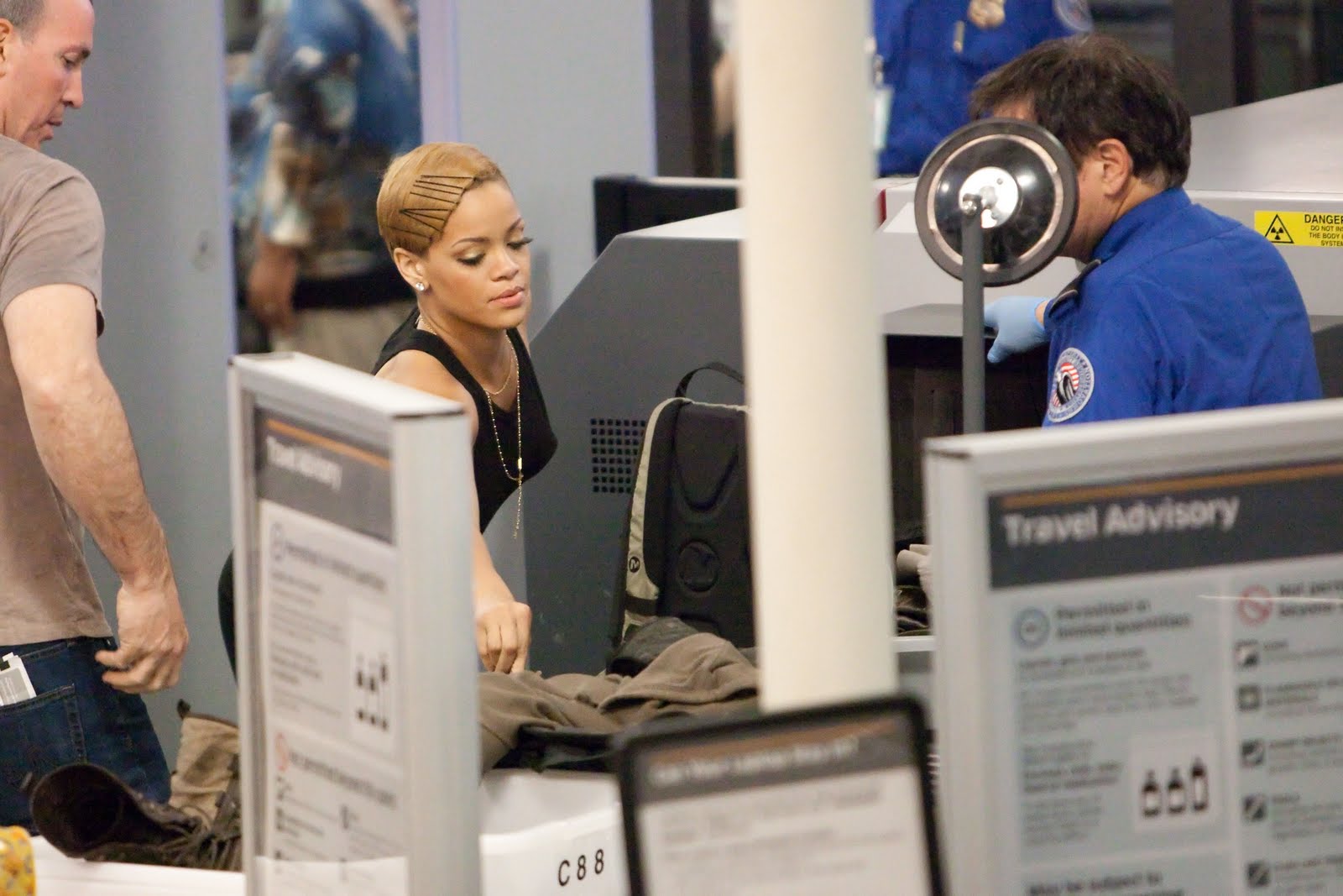 [Rihanna_-_Looks_distressed_as_she_receives_the_full_body_search_while_trying_to_depart_LAX_03.12.09__05.jpg]