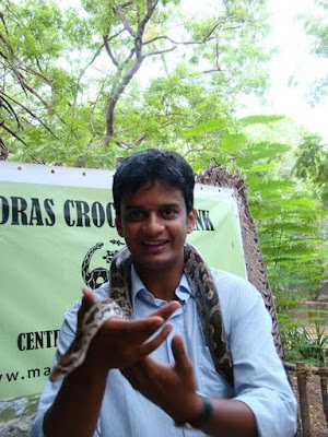 Ravi holding a live snake at crocodile bank