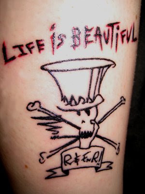 Verdict: The dude has a Guns 'N' Roses tattoo. And his name isn't Slash or