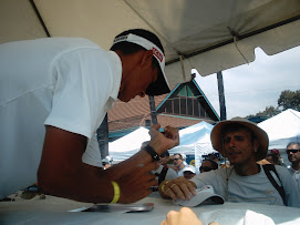 Macca signing autographs