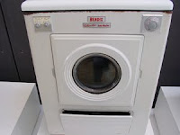 Photograph of a vintage clothes washer.