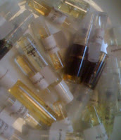 Tumble of perfume sample vials.