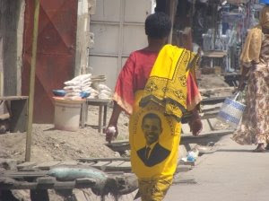 Get a brain, morans! Man+walking+with+Obama+Kanga