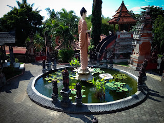 Yard Of Buddhist Temple With Buddha Statue Give Blessings In The Middle Of The Pond In Bali Indonesia