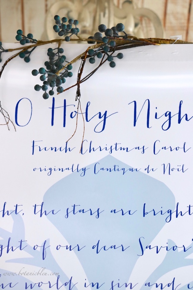 Blue and white English lyrics of a French Christmas carol originally titled Cantique de Noël