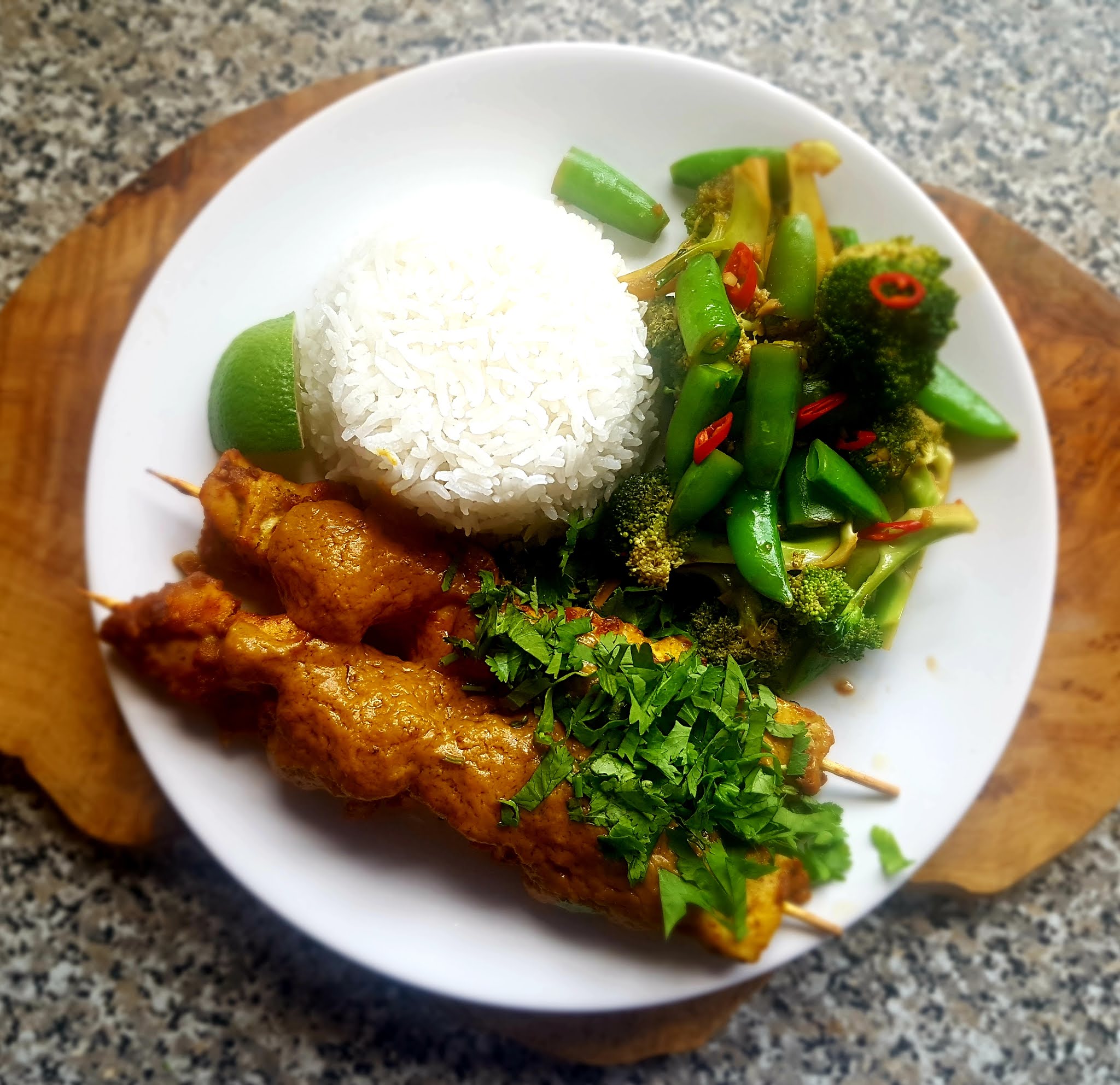 Malaysian chicken satay with garlic stirfried broccoli
