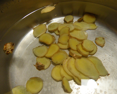 Saucepan with Ginger Slices and Water