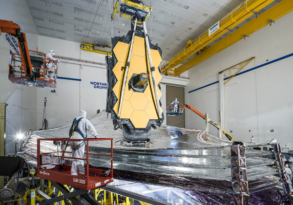 Technicians watch as NASA's James Webb Space Telescope unfurls its sunshield during a final pre-launch test at the Northrop Grumman facility in Redondo Beach, California last year. Technicians watch as NASA's James Webb Space Telescope unfurls its sunshield during a final pre-launch test at the Northrop Grumman facility in Redondo Beach, California last year.