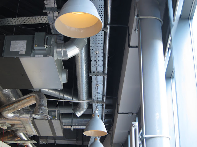 Exposed metal pipes and boxes - silver -decorating restaurant ceiling