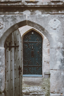 antique door opened with another closed behind it