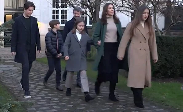 Princess Isabella wore a turtleneck sweater from Zara. camel wool coat. Crown Princess Mary wore a green wool and cashmere coat from Theory