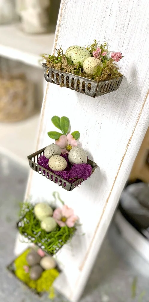 Repurposed metal soap baskets with Easter eggs