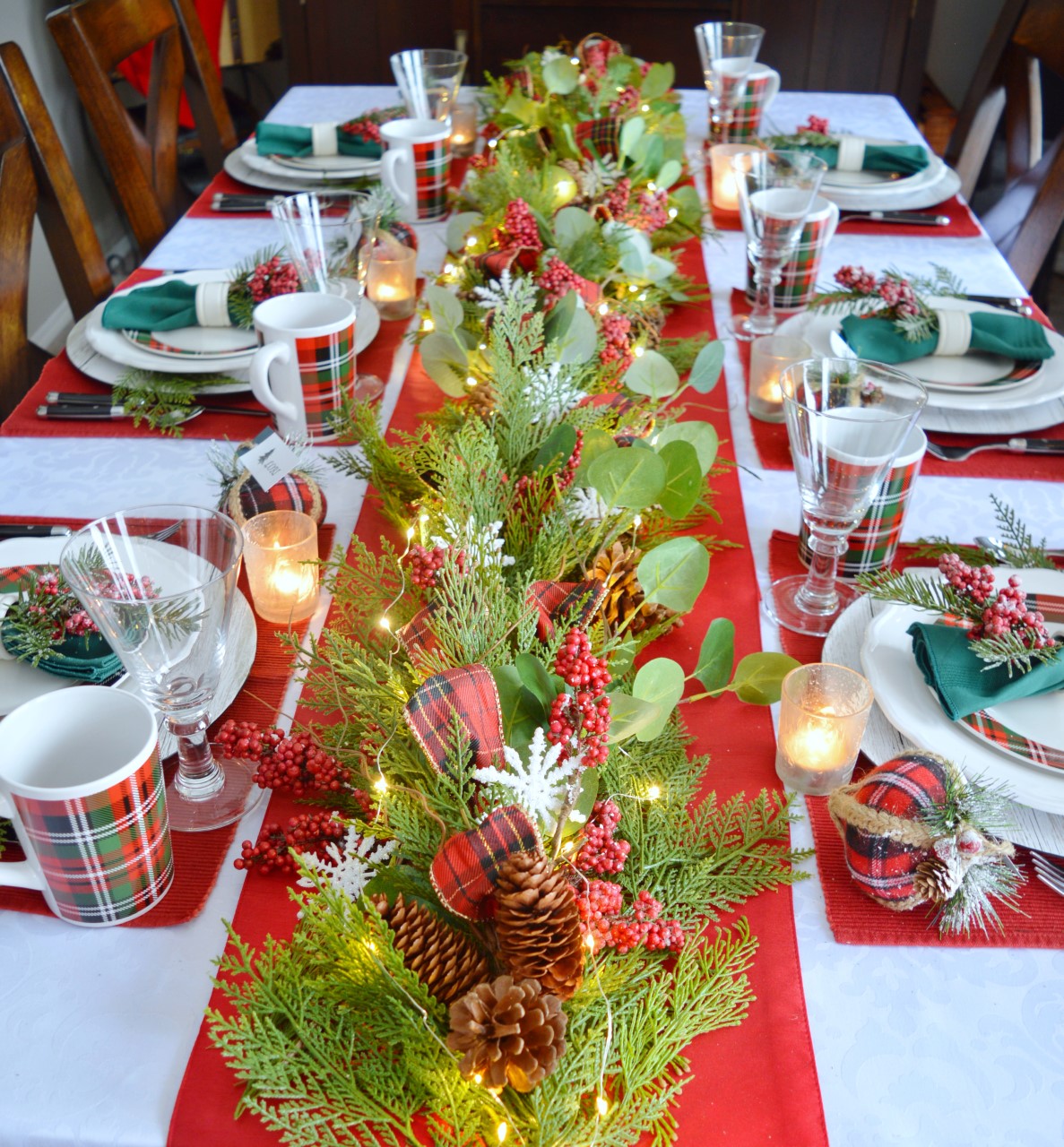 Dining Delight: Cozy Plaid Christmas Tablescape with Garland Centerpiece