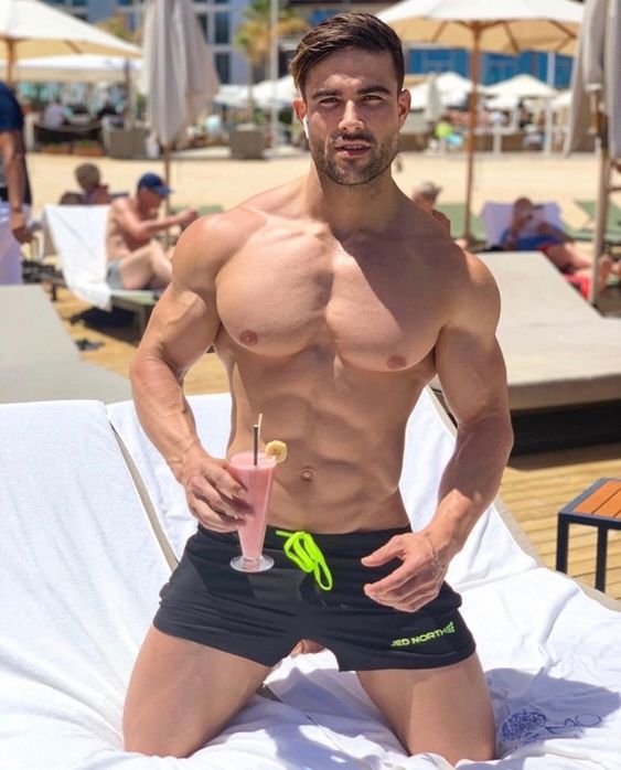 seductive-muscular-gay-guys-shirtless-body-pecs-drinking-cocktail-beach