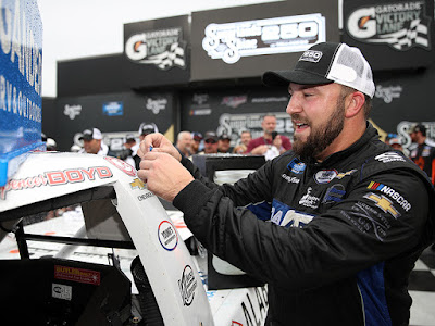 Spencer Boyd, driver of the #20 Alabama Roofing Professionals Chevrolet, celebrates in victory lane after winning the #NASCAR Gander Outdoor Truck Series Sugarlands Shine 250.