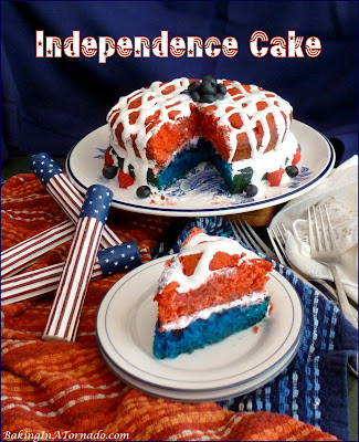 Independence Cake, to honor freedom and independence, a moist red, white, and blue cake baked with raspberries and blueberries in the layers. | Recipe developed by www.BakingInATornado.com | #recipe #cake