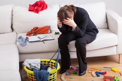 stressed woman in her messy home