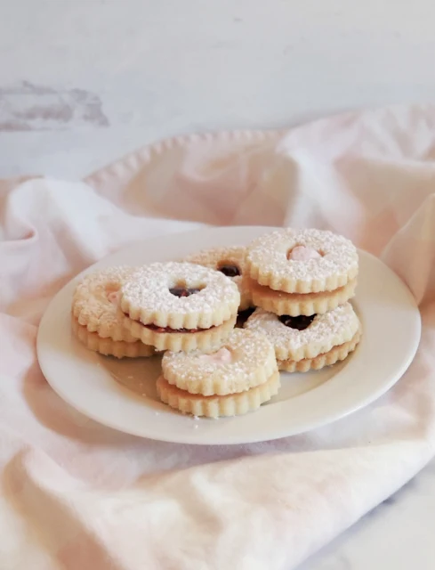 plate of valentine heart linzer cookies