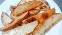 Cooked and roasted potato wedges