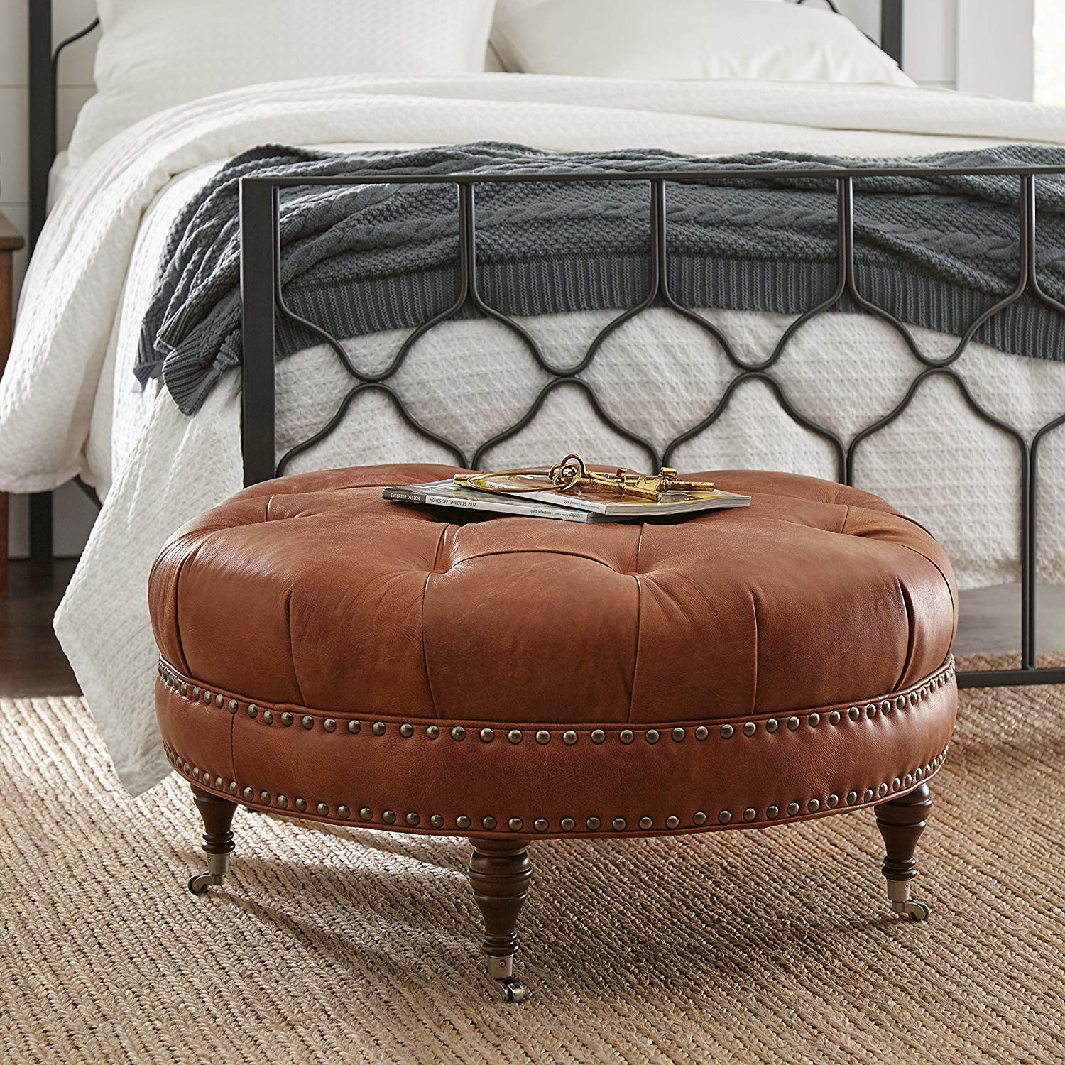 Button Tufted Round Leather Wheeled Ottoman with Spindled Wooden Legs