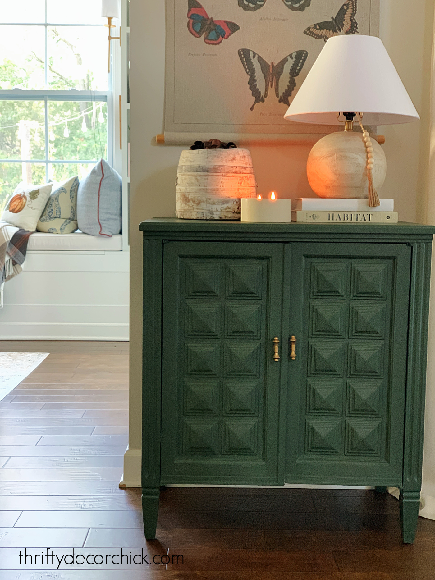 Dark green cabinet with decor