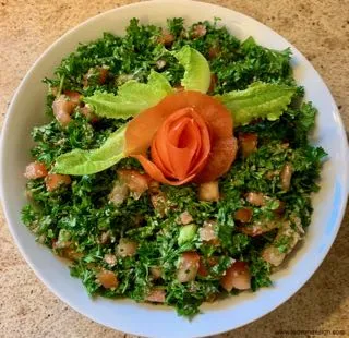 Nicely decorated tabbouleh plate.