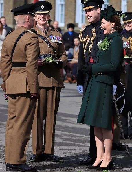 Alexander McQueen deep green coatdress, Kiki tourmaline earrings, Gianvito Rossi pumps