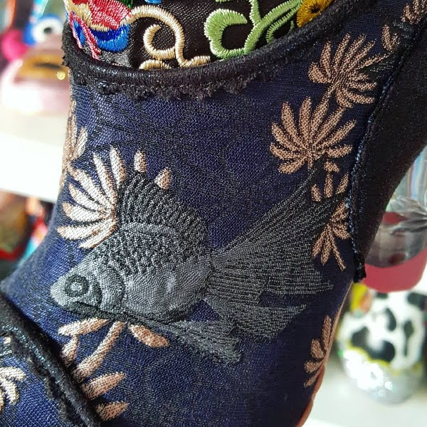 fish brocade fabric on uppers of knee high boots