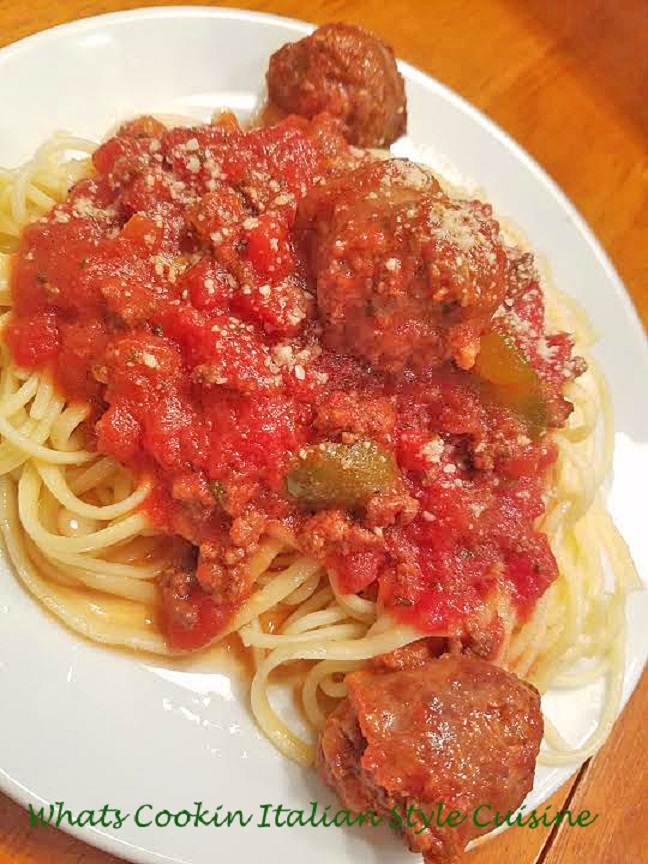 Mom's East End Sausage Pasta Sauce This is a rich Italian bolognese sauce with sausage, sirloin hamburger, tomatoes, over spaghetti pasta, with peppers and garlic on a