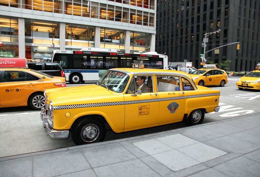 New York Hilton Midtown Hotel welcomes bees at its rooftop and arrive with a vintage yellow taxi